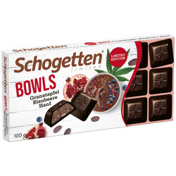 Продуктови Категории Шоколади Schogetten Тъмен шоколад с пълнеж от кисело мляко, какаов крем с какаови зърна, кубчета нар и боровинки 100 гр